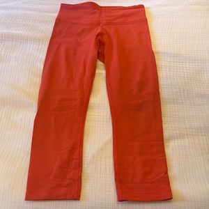 Lululemon orange Wunder Under Crop leggings